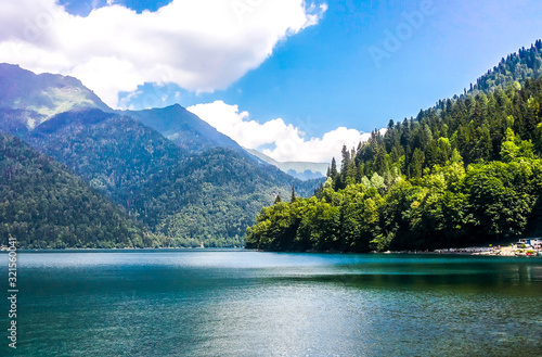 Lake Ritsa in the Caucasus Mountains, in the north-western part of Abkhazia, surrounded by mixed mountain forests and subalpine meadows. photo