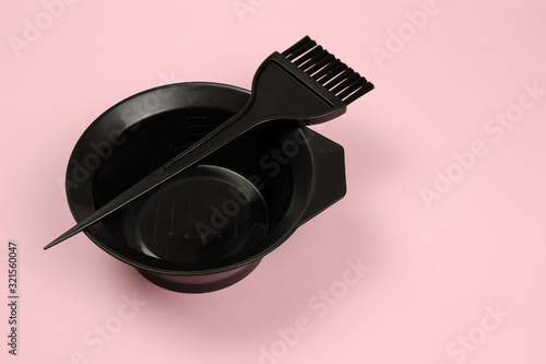 Tools for hairdresser, for painting hair on a pink background photo