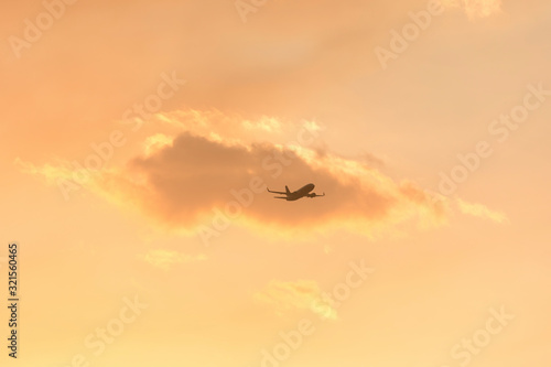 A fire fighting water bombing plane in bush fire smoke at sunset in The Blue Mountains in Australia