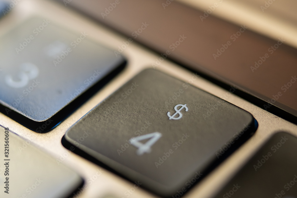 The dollar key on a metallic keyboard