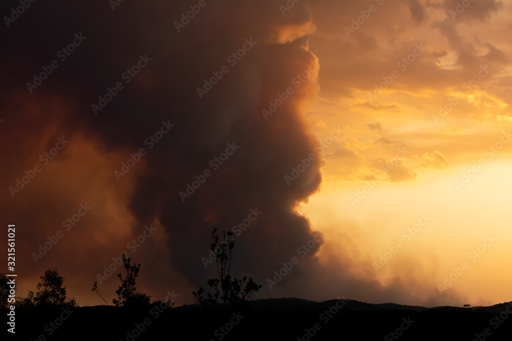 Bush fire smoke at sunset in a valley in The Blue Mountains in Australia