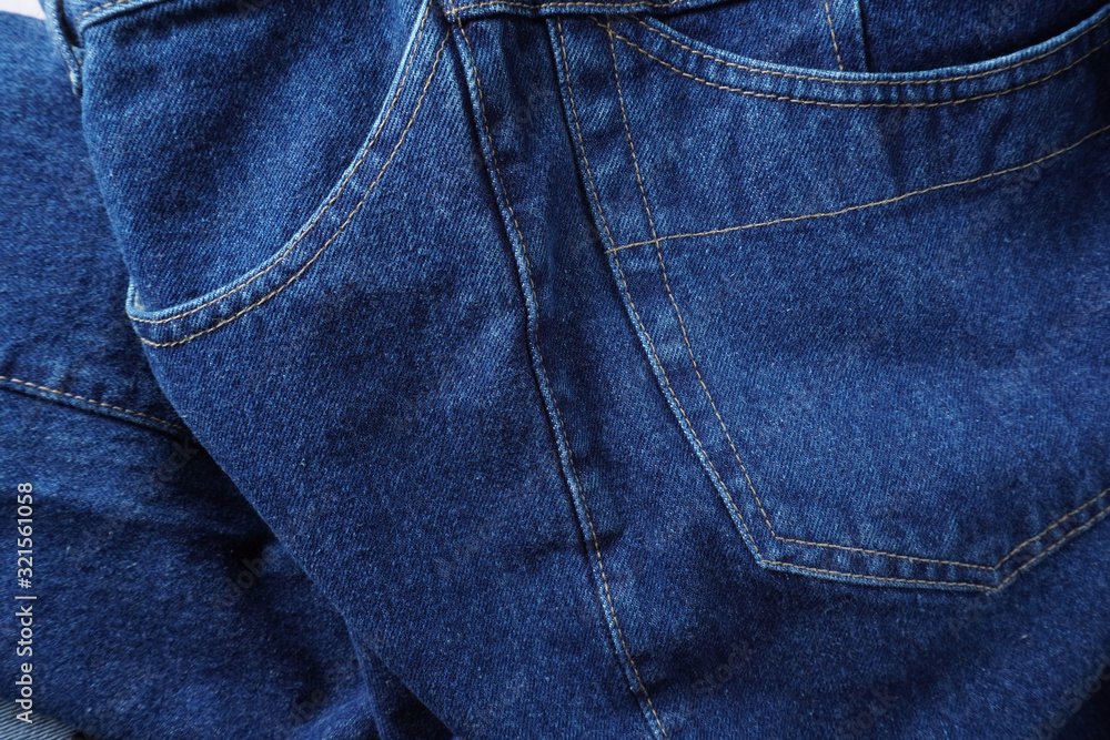 Naklejka premium Jeans background. Denim jeans texture. Blue denim pattern.