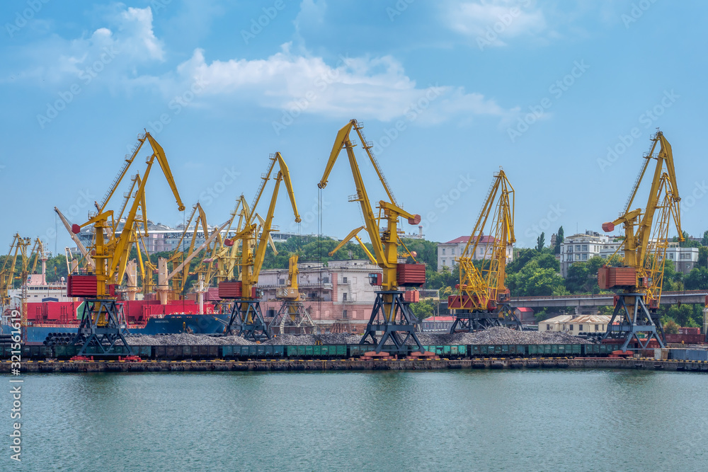 Cargo crane, ship and grain dryer in port Odessa, Ukraine