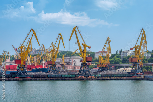 Obraz na płótnie Cargo crane, ship and grain dryer in port Odessa, Ukraine w salonie