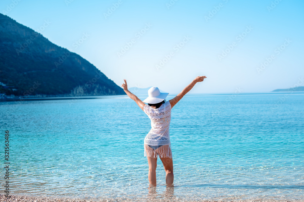 A women enjoying in nature by the water
