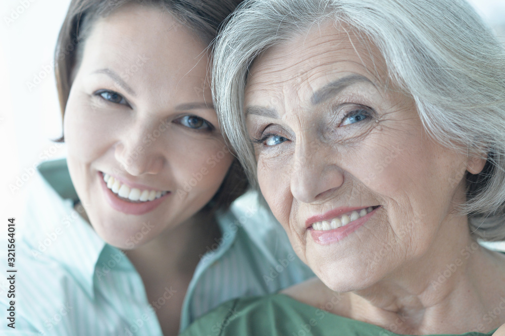 Close up portrait of senior woman with daughter at home Close up portrait of senior woman with daughter at home