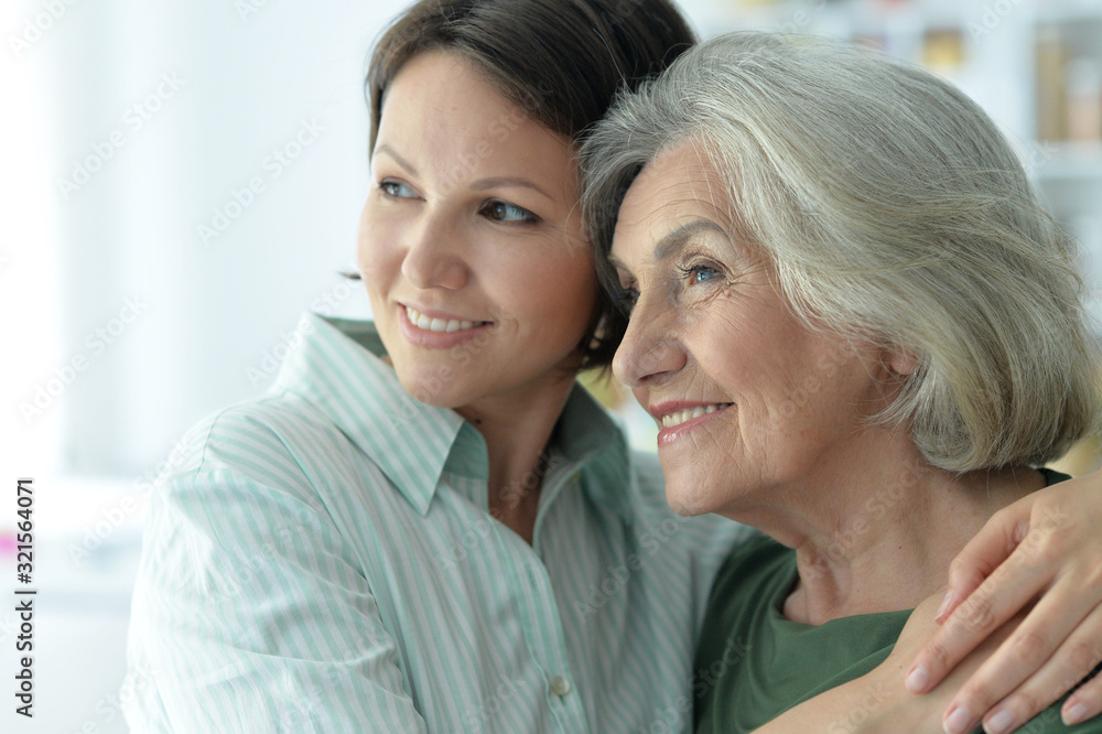 Close up portrait of senior woman with daughter at home Close up portrait of senior woman with daughter at home