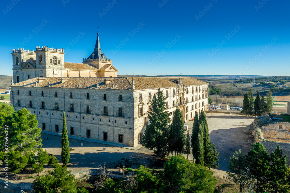Aerial view of Ucles castle and monastery with two keeps gates and towers encircling a bailey in Cuenca Spain