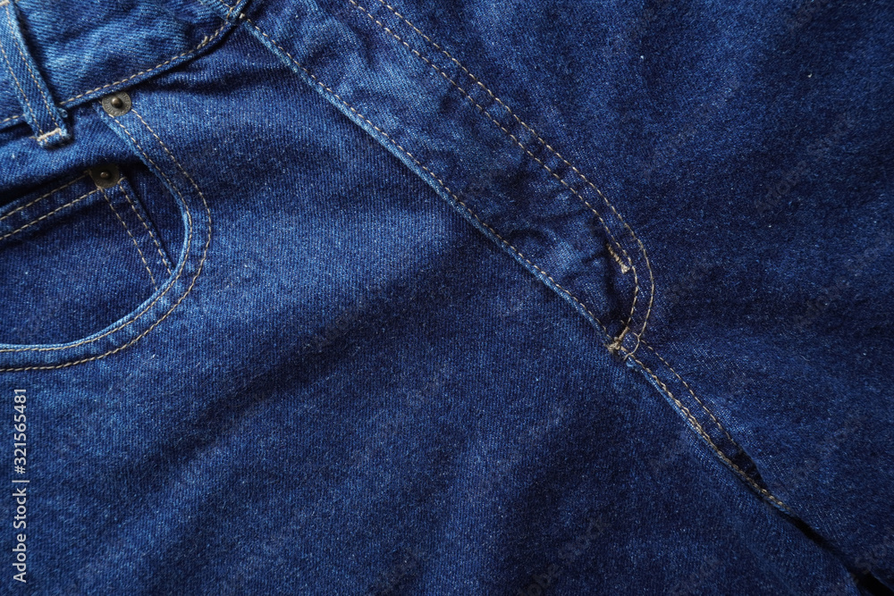 Naklejka premium Jeans background. Denim jeans texture. Blue denim pattern.
