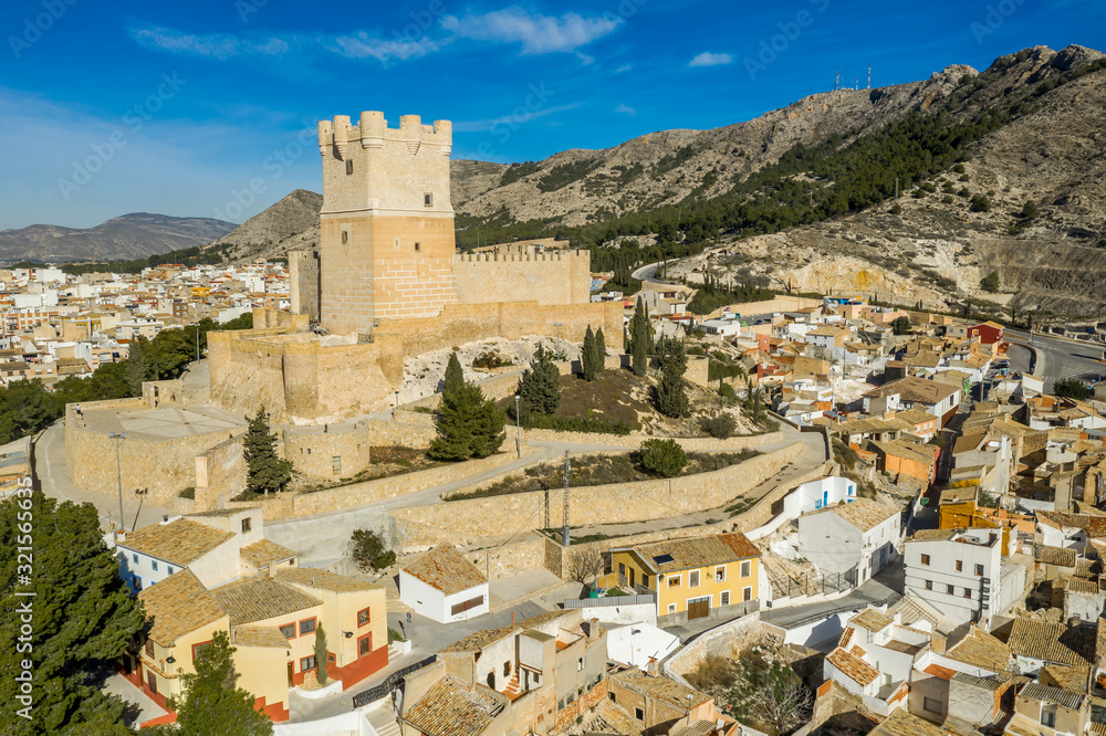 Aerial view of Atalaya castle over Villena Spain. The fortress has concentric plan, with a rectangular barbican forming space in front of the keep.  The external wall has chemin-de-ronde or wall-walk