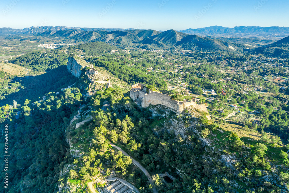Aerial view of Xativa castle located near Valencia Spain on the ancient roadway  Via Augusta leading from Rome to Cartagena. Two forts connected by walls and curtains running down surrounding the city