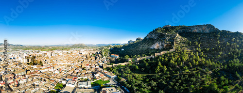 Aerial view of Xativa castle located near Valencia Spain on the ancient roadway  Via Augusta leading from Rome to Cartagena. Two forts connected by walls and curtains running down surrounding the city photo