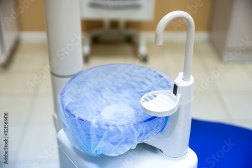 blue spittoon bowl in the dentist's office. dentist's day photo