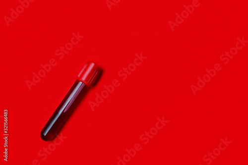 Positive virus Coronavirus blood test on red copy space background for a banner