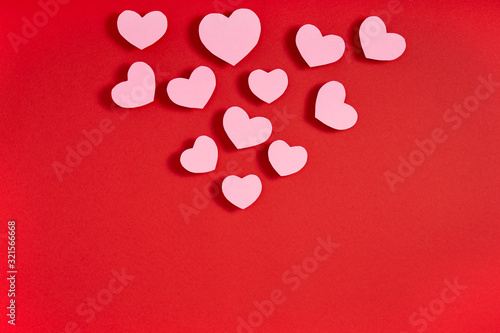 Valentine hearts on red surface. Top view, flat lay, from above, copy space © Photoland