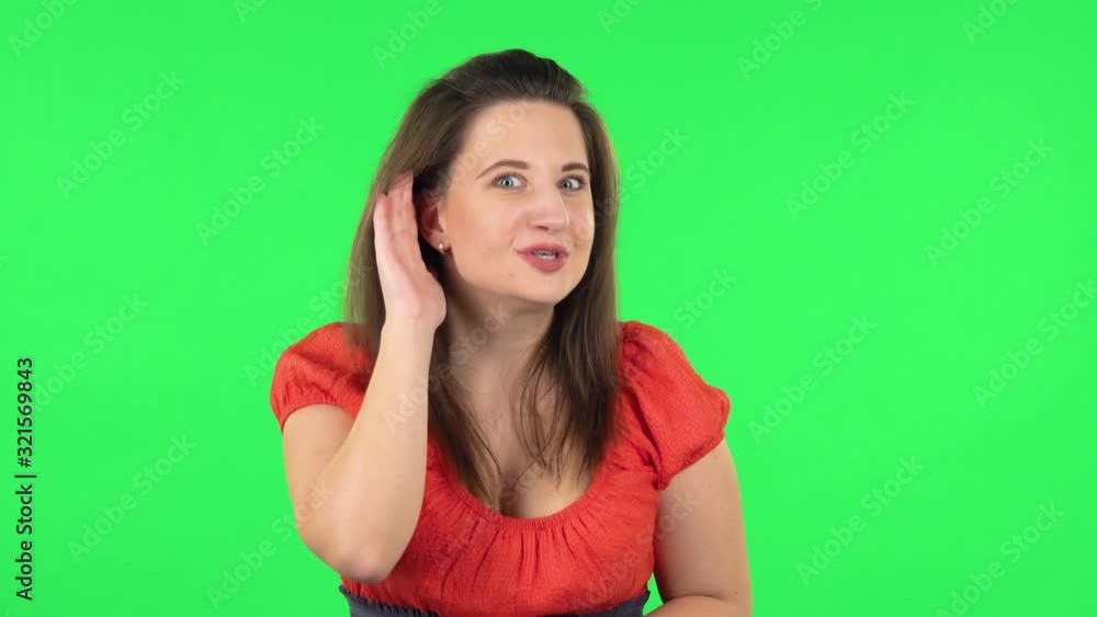 Portrait of girl holding hand near ear trying listen to interesting news expressing communication concept . Greenscreen Portrait of girl holding hand near ear trying listen to interesting news expressing communication concept . Greenscreen