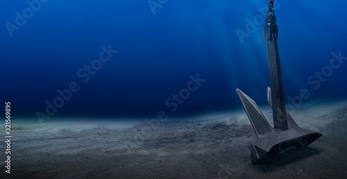 Fotografie Ship anchor underwater on bottom in clean ocean water at anchorage