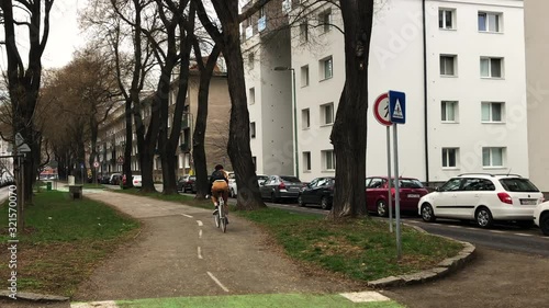 Wallpaper Mural A young lady cycling with retro bicycle on bike trail in the city Torontodigital.ca