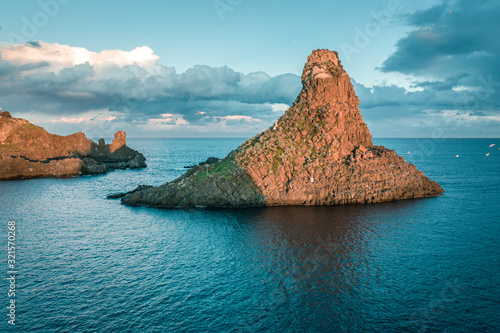 Wallpaper Mural Top view of Aci Trezza, Lachea Island and the Ciclope Stacks at sunset. Sicily, Italy Torontodigital.ca