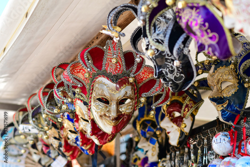Carnival in Venice Italy. Traditional venetian carnival masks in the Italian market for tourists. trip to Italy, carnival 2020. selective focus.