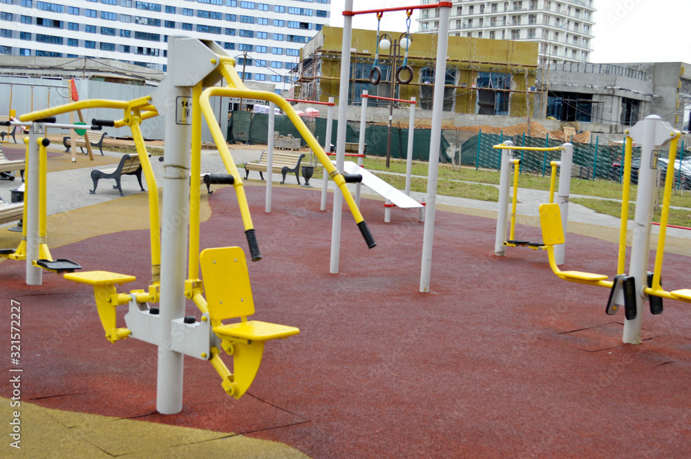 A new modern safe outdoor workout area with exercise equipment for sports in the new district of the city in the courtyard of the new building A new modern safe outdoor workout area with exercise equipment for sports in the new district of the city in the courtyard of the new building
