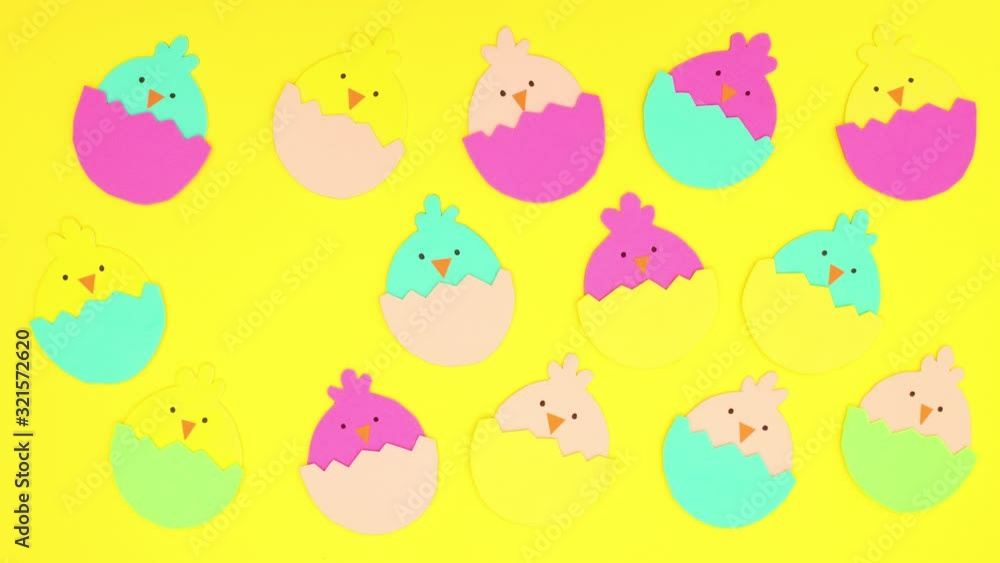 Easter decoration chicken in eggs blinking on yellow background - Stop motion Easter decoration chicken in eggs blinking on yellow background - Stop motion