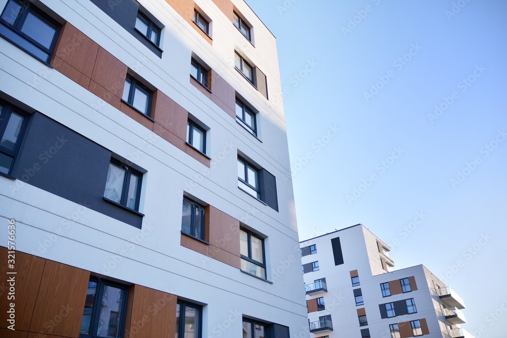 Fototapeta premium Multistory new modern apartment building with architectural details of modern architecture. 