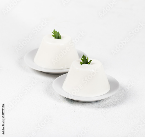 Fotografija Italian dessert Panna cotta vanilla light background