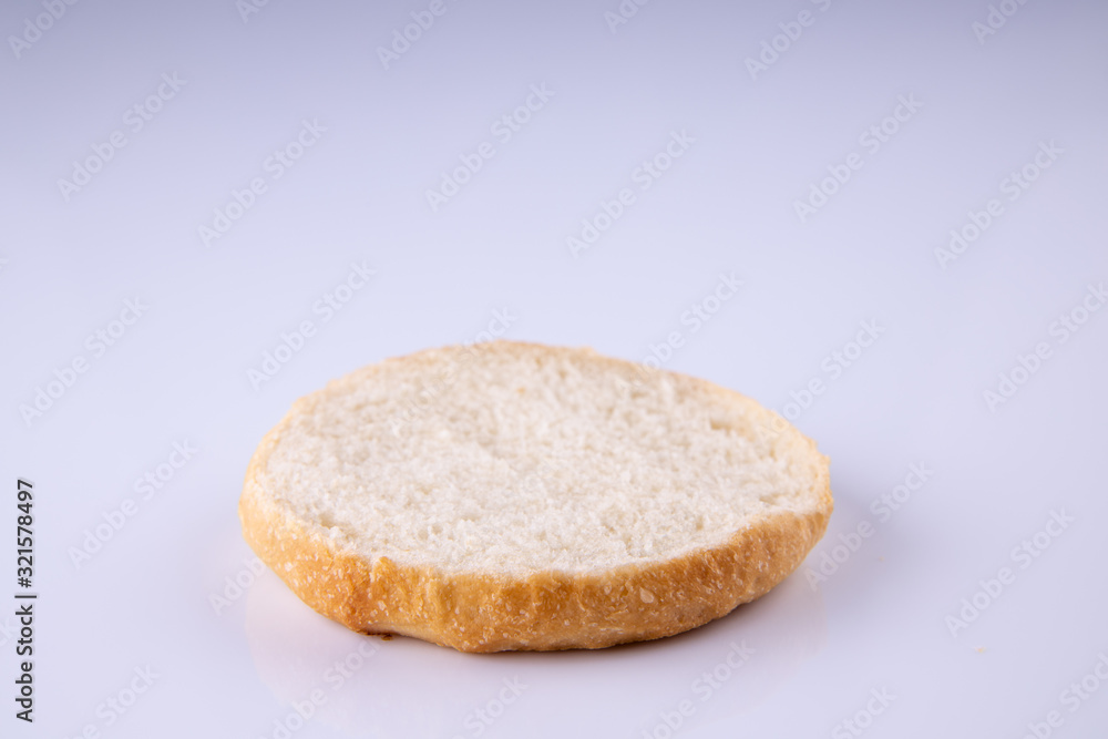phased assembly of a hamburger on a light background phased assembly of a hamburger on a light background
