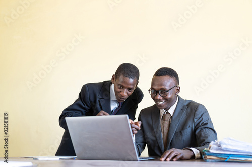  Native African workers at the workplace at university in front of laptop