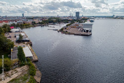 Aerial View of multiple yachts and boats in the dock. Large cruise ship in background.