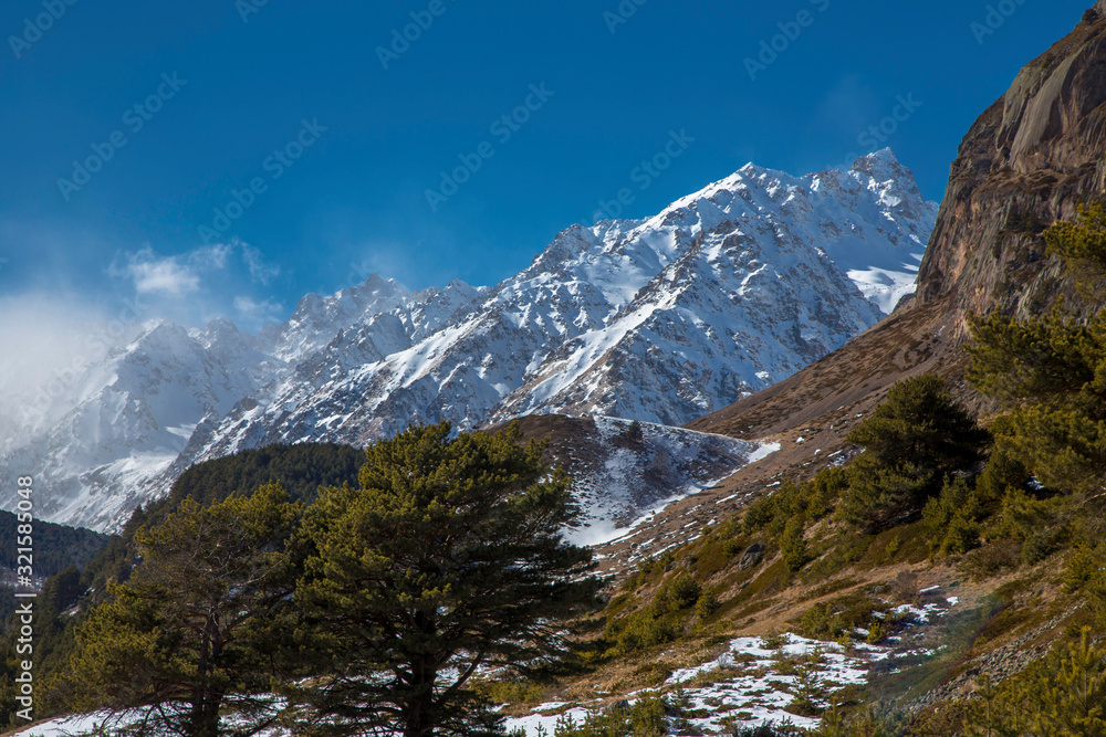 Winter in mountains. The mountain gorge in snow. Landscape of the North Caucasus