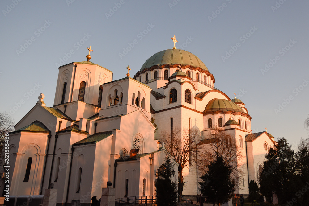 Temple of St. Sava in Serbian capital Belgrade during the warm winter sunset positioned in the middle of the frame