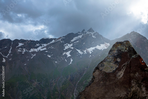 Overcast in mountains. Beautiful mountain rocks in clouds. Landscape of the North Caucasus © Ivan_Gatsenko