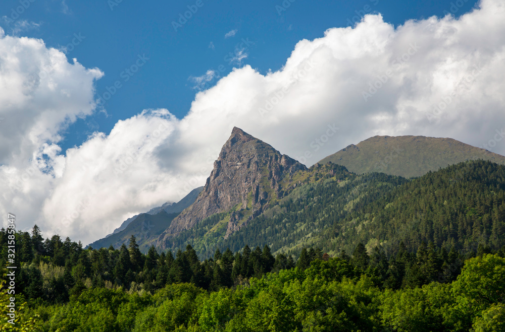 Overcast in mountains. Beautiful mountain rocks in clouds. Landscape of the North Caucasus Overcast in mountains. Beautiful mountain rocks in clouds. Landscape of the North Caucasus