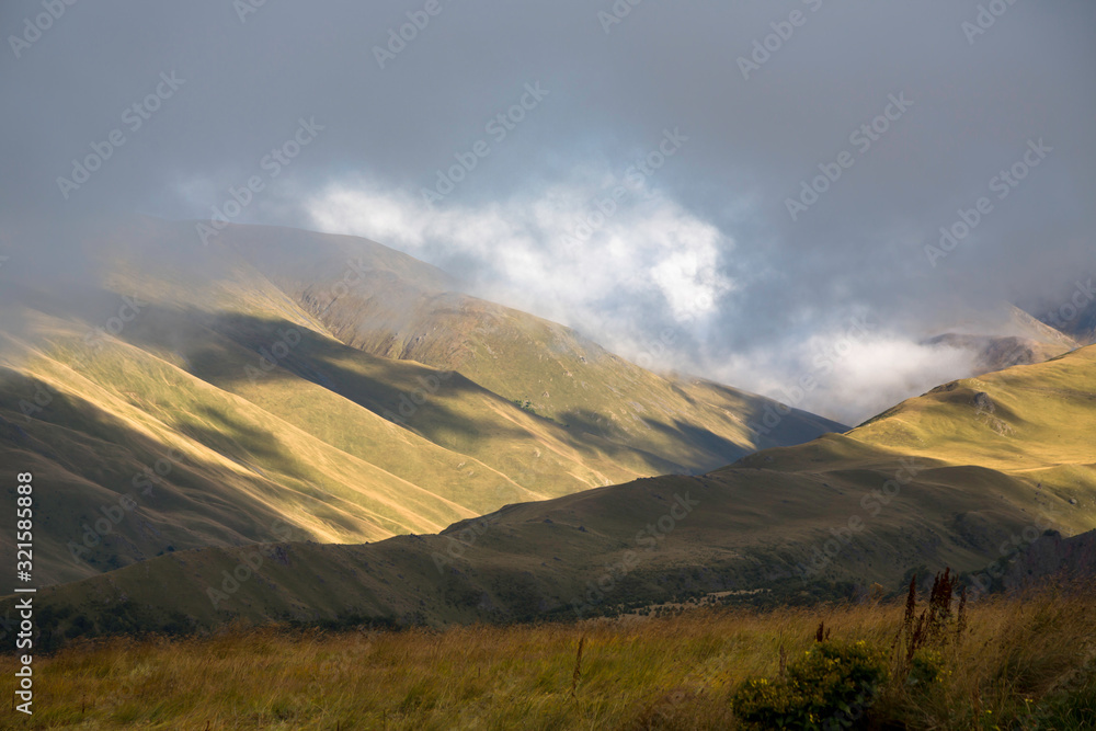 Overcast in mountains. Beautiful mountain rocks in clouds. Landscape of the North Caucasus