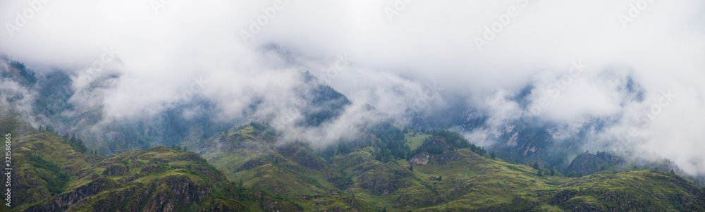 Mountains in the fog, natural light, wide view