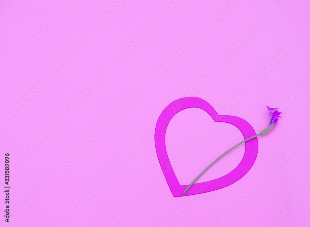 Pink heart with a little flower on pastel pink background. Valentines day, Mother day or celebration concept.