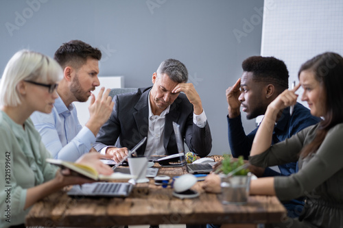 Business People Arguing In Meeting