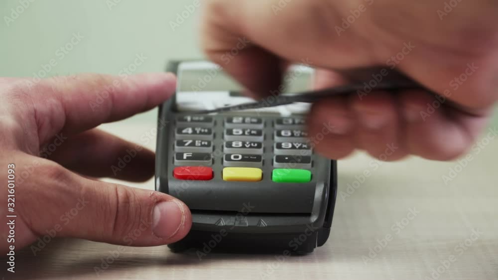 Payment via Bank terminal card. Close-up. Cashless settlement Payment via Bank terminal card. Close-up. Cashless settlement