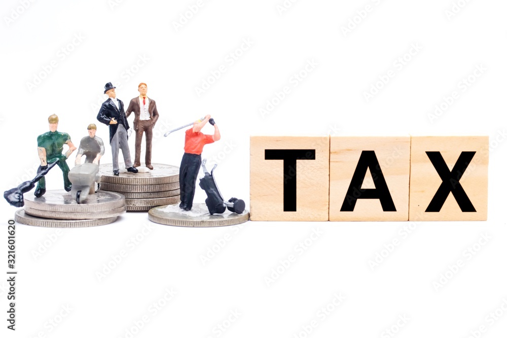 Tax reform concept with wooden tiles, worker and CEO playing golf miniature. In current economy, middle and lower class worker paying high tax compare to higher class. Tax reform concept with wooden tiles, worker and CEO playing golf miniature. In current economy, middle and lower class worker paying high tax compare to higher class.
