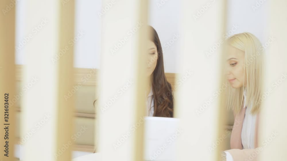 Asian businesswoman discussing to her coworkers Asian businesswoman discussing to her coworkers