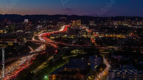 Wallpaper Mural Aerial view of freeway and interstate street traffic during rush hour on the I-405 and I-10 in urban Los Angeles California with cars and car lights below at night. Torontodigital.ca