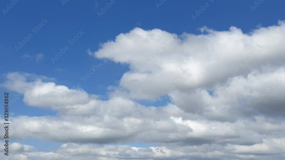 Beautiful blue summer sky with dense thick rain clouds moving across the horizon cloudscape time lapse Beautiful blue summer sky with dense thick rain clouds moving across the horizon cloudscape time lapse