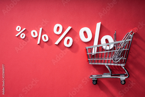 Sale Percents Falling Into Shopping Cart photo