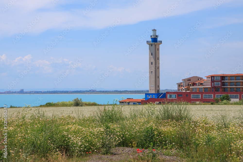 Beautiful seaside landscape with a lighthouse and buildings