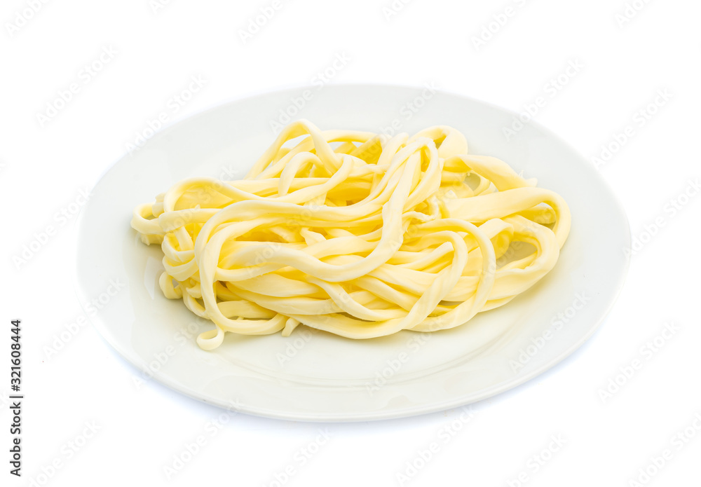 smoked white cheese with fibers and stripes on a white plate isolated smoked white cheese with fibers and stripes on a white plate isolated