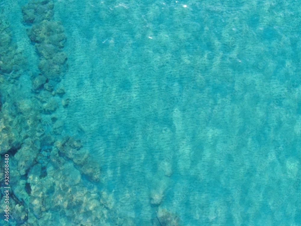 Texture of the water surface. Aerial view of sea calm waters  colour torquoise