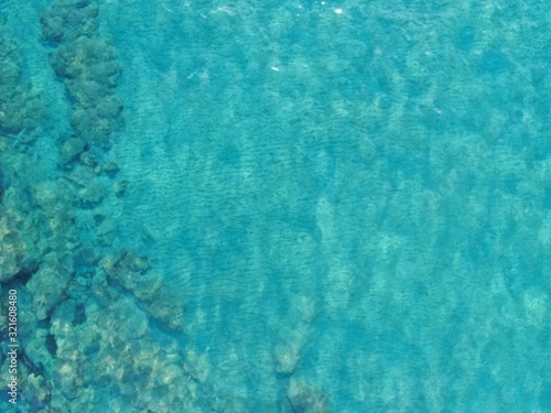 Texture of the water surface. Aerial view of sea calm waters colour torquoise