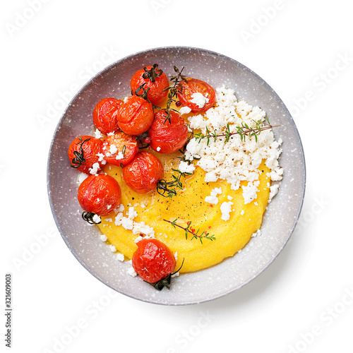Homemade polenta with grilled cherry tomatoes and ricotta cheese. isolated on white background